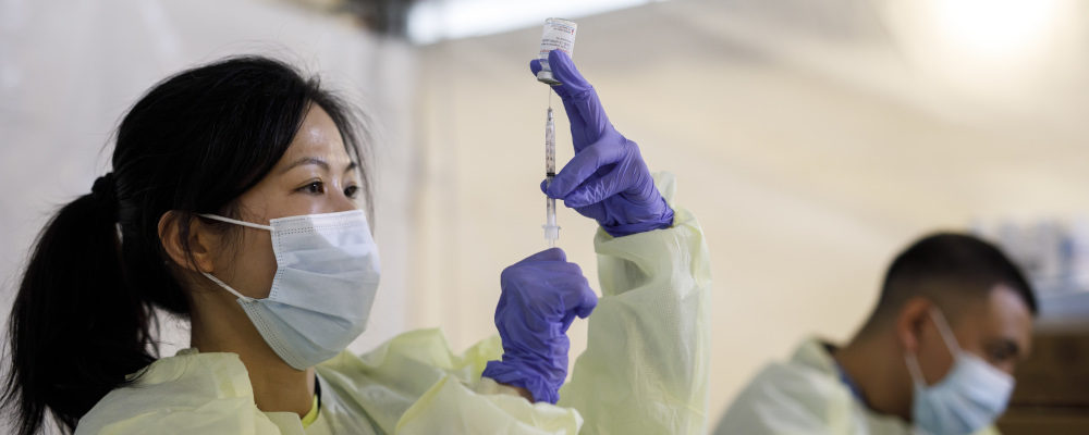 Linh Huynh from Women's College Hospital prepares doses of the Moderna COVID-19 vaccine at a pop-up vaccine clinic in Toronto on April 17, 2021. Cole Burston/The Canadian Press
