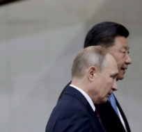 Russia's President Vladimir Putin and China's President Xi Jinping walk in Brasilia, Brazil on Nov. 14, 2019. Eraldo Peres/AP Photo