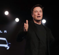 Tesla CEO Elon Musk speaks before unveiling the Model Y at Tesla's design studio in Hawthorne, California. Jae C. Hong/AP Photo