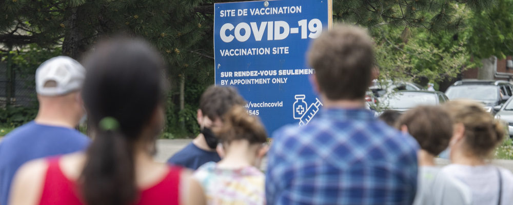 People line up at a COVID-19 vaccination site in Montreal on May 22, 2021. Graham Hughes/The Canadian Press