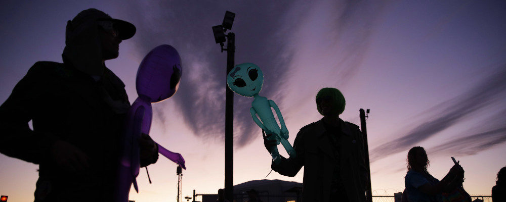 Two men hold inflatable aliens near Area 51 on Sept. 20, 2019. John Locher/AP Photo