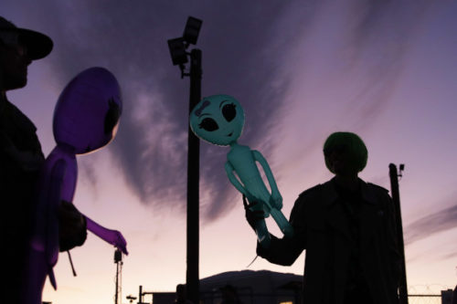 Two men hold inflatable aliens near Area 51 on Sept. 20, 2019. John Locher/AP Photo