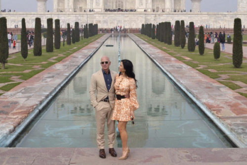 Amazon CEO Jeff Bezos and his partner Lauren Sánchez stand for photographs in front of the Taj Mahal in Agra, India on Jan. 21, 2020. Pawan Sharma/AP Photo.