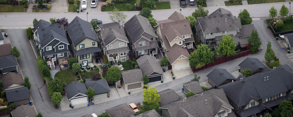 Houses are seen in an aerial view, in Langley, B.C., on May 16, 2018. Darryl Dyck/The Canadian Press.