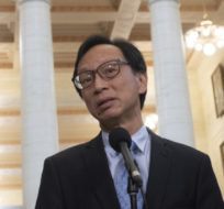 Senator Yuen Pau Woo, facilitator of the Independent Senators Group (ISG) speaks with the media in the foyer of the Senate on November 28, 2019. Adrian Wyld/The Canadian Press.