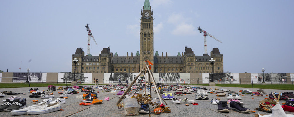 A memorial on Parliament Hill continues to be displayed in Ottawa on Monday, July 19, 2021. Sean Kilpatrick/The Canadian Press.