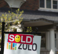 A sold sign is shown in front of a west-end Toronto home. Graeme Roy/The Canadian Press.