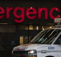 A ambulance drives past the emergency entrance of Vancouver General Hospital in Vancouver, B.C., Friday, April 9, 2021. Jonathan Hayward/The Canadian Press.