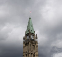 Storm clouds pass by the Peace tower and Parliament hill  Tuesday August 18, 2020 in Ottawa. Adrian Wyld/The Canadian Press.