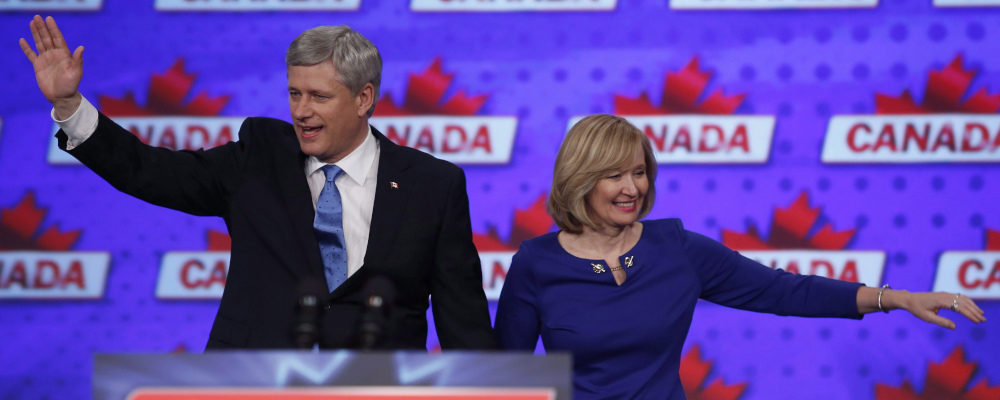 Conservative leader Stephen Harper along with his wife Laureen wave to supporters in Monday, Oct. 19, 2015 in Calgary. Jeff McIntosh/The Canadian Press.