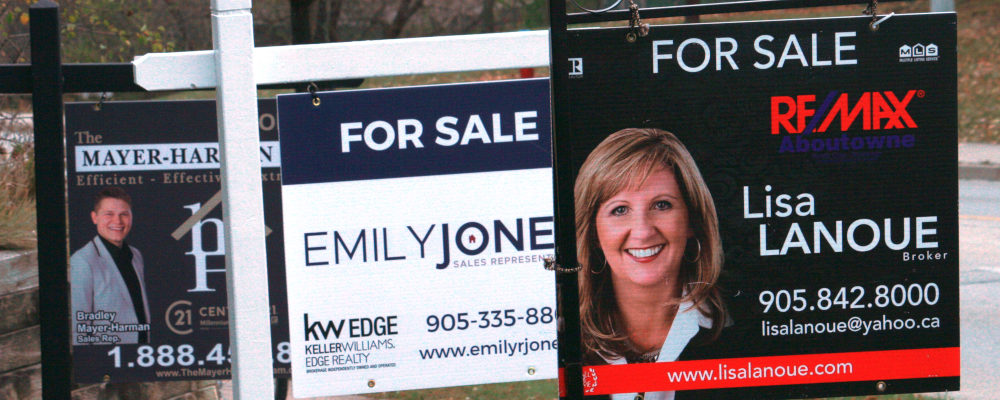 Real estate for sale signs are shown in Oakville, Ont., on Wednesday, Nov.18, 2020. Richard Buchan/The Canadian Press.