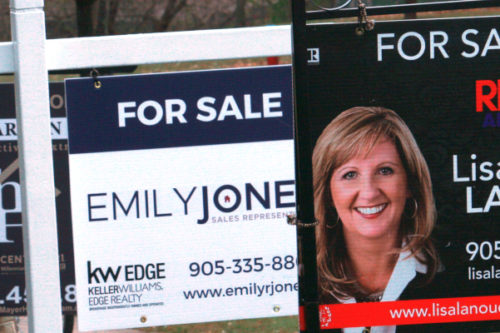 Real estate for sale signs are shown in Oakville, Ont., on Wednesday, Nov.18, 2020. Richard Buchan/The Canadian Press.