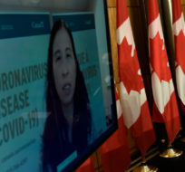 Prime Minister Justin Trudeau listens as Chief Public Health Officer of Canada Dr. Theresa Tam is seen via videoconference during a news conference on the COVID-19 pandemic, in Ottawa, on June 4, 2021. Justin Tang/The Canadian Press.