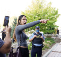 Security keeps watch as protesters wait for Liberal leader Justin Trudeau to leave the University of Windsor in Windsor, Ont., on Friday, Sept. 17, 2021. Sean Kilpatrick/The Canadian Press.