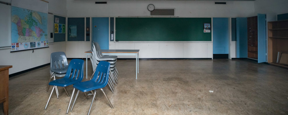 A classroom is seen in the former New Westminster Secondary School, which was built on a cemetery in the 1940s and is now shuttered after a new school was built nearby, in New Westminster, B.C., on Thursday, October 14, 2021. Darryl Dyck/The Canadian Press.
