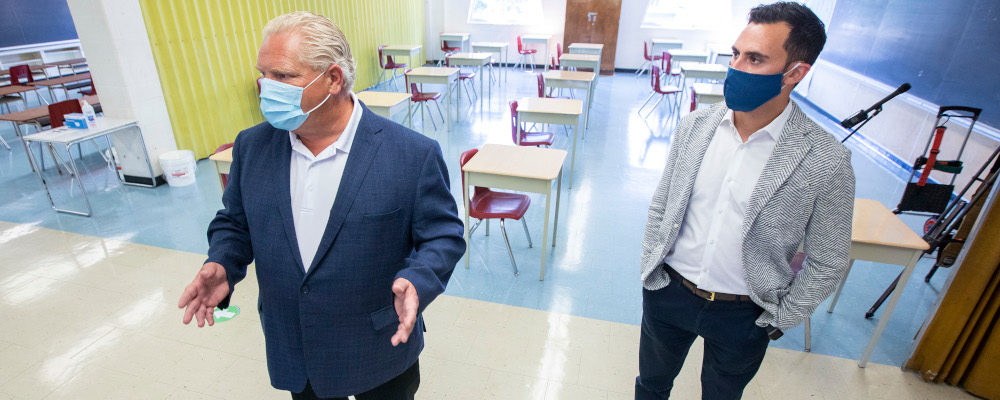 Ontario Premier Doug Ford, left, and Education Minister Stephen Lecce take a tour of Kensington Community School, September 1, 2020. Carlos Osorio/The Canadian Press.
