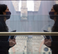 Chief Public Health Officer Theresa Tam is reflected in a wall as she leaves a news conference Tuesday January 5, 2021 in Ottawa. Adrian Wyld/The Canadian Press. 