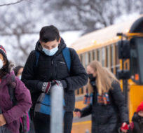 Students arrive for in-class learning at an elementary school in Mississauga, Ont., on Wednesday, January 19, 2022. Nathan Denette/The Canadian Press.