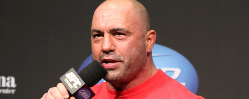 FILE - UFC announcer and podcaster Joe Rogan speaks at the weigh in before a UFC on FOX 5 event in Seattle, on Dec. 7, 2012. Gregory Payan/AP Photo.