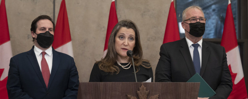 Public Safety Minister Marco Mendicino and Emergency Preparedness Minister Bill Blair look on as Finance Minister Chrystia Freeland speaks about the implementation of the Emergencies Act on Feb. 17, 2022 in Ottawa. Adrian Wyld/The Canadian Press.
