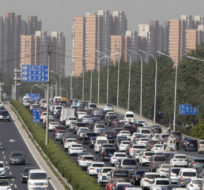 A traffic jam forms on an expressway in Beijing Wednesday, May 13, 2020. Ng Han Guan/AP Photo.