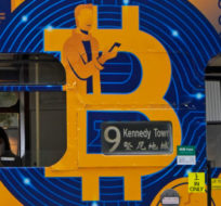 This May 12, 2021, file photo shows an advertisement for the cryptocurrency Bitcoin displayed on a tram in Hong Kong. Kin Cheung/AP Photo.