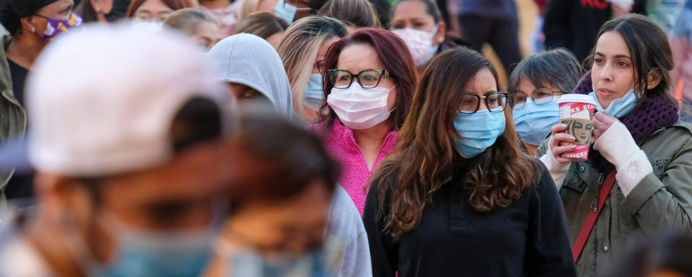 Black Friday shoppers wearing face masks wait in line to enter a store at the Citadel Outlets in Commerce, Calif., Friday, Nov. 26, 2021. Ringo H.W. Chiu, File/AP Photo.