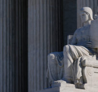 "The Authority of Law," sculpted by James Earle Fraser, stands outside the Supreme Court building on Capitol Hill in Washington, Monday, Feb. 21, 2022. Patrick Semansky/AP Photo.