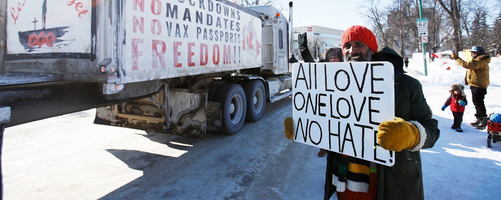 A small group of COVID-19 mandate protesters remain on the street as a convoy forms and they head home Wednesday, February 23, 2022. John Woods/The Canadian Press. 