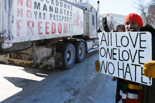 A small group of COVID-19 mandate protesters remain on the street as a convoy forms and they head home Wednesday, February 23, 2022. John Woods/The Canadian Press. 
