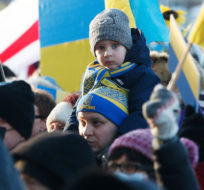 Thousands of people rally in support of the Ukraine outside the Manitoba Legislature in Winnipeg Saturday, February 26, 2022. The group was rallying against the Russian invasion of The Ukraine. John Woods/The Canadian Press.
