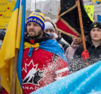 A large crowd gathers to show their support for the people of Ukraine following an invasion by the Russian Federation, in Toronto, Sunday, Feb. 27, 2022. Chris Young/The Canadian Press.