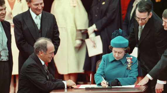 The Queen signs Canada's constitutional proclamation in Ottawa on April 17, 1982 as Prime Minister Pierre Trudeau looks on. With the stroke of a pen by the Queen in Ottawa, Canada had its own Constitution. Ron Poling/The Canadian Press.