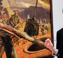 Curator Lindsey Sharman speaks about Second World War silkscreens, that brightened the living quarters of Canadian soldiers, on display at the Founders’ Gallery at The Military Museums in Calgary, Alta., Thursday, Nov. 5, 2015. Jeff McIntosh/The Canadian Press.