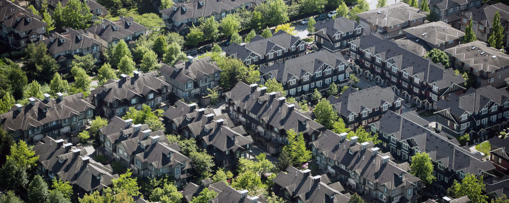 A neighbourhood of townhouses is seen in an aerial view in Richmond, B.C., on Wednesday May 16, 2018. Darryl Dyck/The Canadian Press.