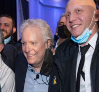 Jean Charest poses for pictures with supporters Thursday, March 24, 2022 as he launches the Quebec part of his campaign for the Consevative Party leadership in Laval, Quebec. Ryan Remiorz/The Canadian Press.