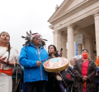 Members of the Assembly of First Nations sing a traditional song outside St. Peter's Square as their delegation is meeting with Pope Francis at the Vatican, Thursday, March 31, 2022. Andrew Medichini/AP Photo.