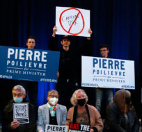 Supporters wait for federal Conservative leadership candidate Pierre Poilievre to arrive at an anti-carbon tax rally in Ottawa on Thursday, March 31, 2022. Patrick Doyle/The Canadian Press.