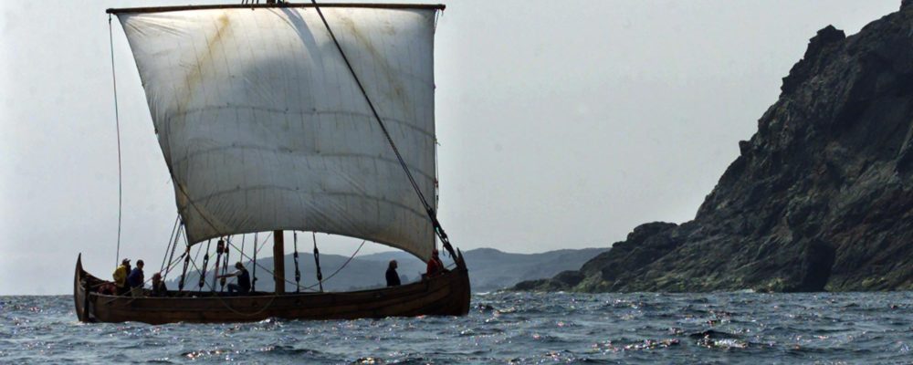 The American Viking boat Snorri, built in Maine, heads past an island near L'Anse aux Meadows, Nfld. on Thursday, July 27, 2000. Andrew Vaughan/CP Photo.