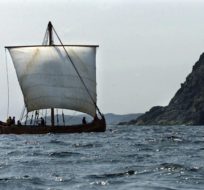 The American Viking boat Snorri, built in Maine, heads past an island near L'Anse aux Meadows, Nfld. on Thursday, July 27, 2000. Andrew Vaughan/CP Photo.