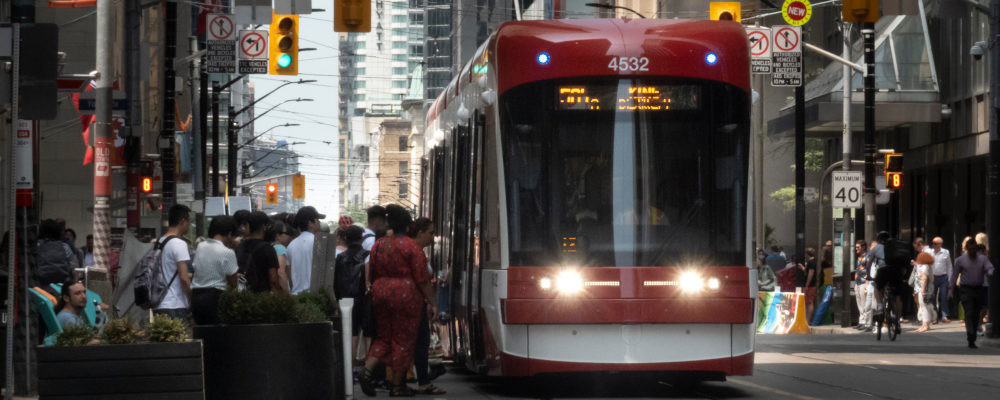 Transit riders board a streetcar in downtown Toronto on Wednesday, July 10, 2019. Graeme Roy/The Canadian Press.