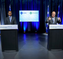Quebec Health Minister Christian Dube, flanked by Minister for Health and Social Services Lionel Carmant, responds to a question after revealing the province's new health care plan during a news conference in Montreal on Tuesday, March 29, 2022. Paul Chiasson/The Canadian Press.