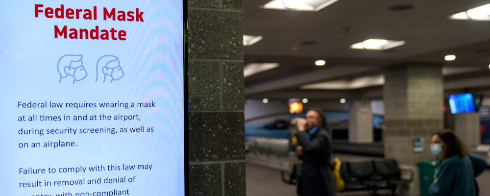 Instructions on a federal mask mandate is still displayed on a screen as Rhode Island T.F. Green International Airport worked on updating their signage Tuesday, April 19, 2022, in Providence, R.I. David Goldman/AP Photo.