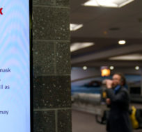 Instructions on a federal mask mandate is still displayed on a screen as Rhode Island T.F. Green International Airport worked on updating their signage Tuesday, April 19, 2022, in Providence, R.I. David Goldman/AP Photo.