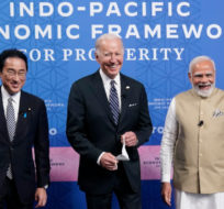 Japanese Prime Minister Fumio Kishida, left, President Joe Biden and Indian Prime Minister Narendra Modi pose for photos as they arrive at the Indo-Pacific Economic Framework for Prosperity launch event at the Izumi Garden Gallery, Monday, May 23, 2022, in Tokyo. Evan Vucci/AP Photo.