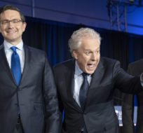 Candidates Scott Aitchison, left,  Pierre Poilievre, Jean Charest    and Roman Baber, pose for photos after the French-language Conservative Leadership debate on May 25, 2022 in Laval, Que. Ryan Remiorz/The Canadian Press.