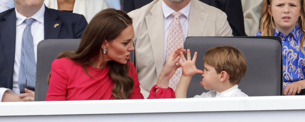 Kate, Duchess of Cambridge, left speaks with Prince Louis, during the Platinum Jubilee Pageant, in London, Sunday June 5, 2022, on the last of four days of celebrations to mark the Platinum Jubilee. Chris Jackson/AP Photo.