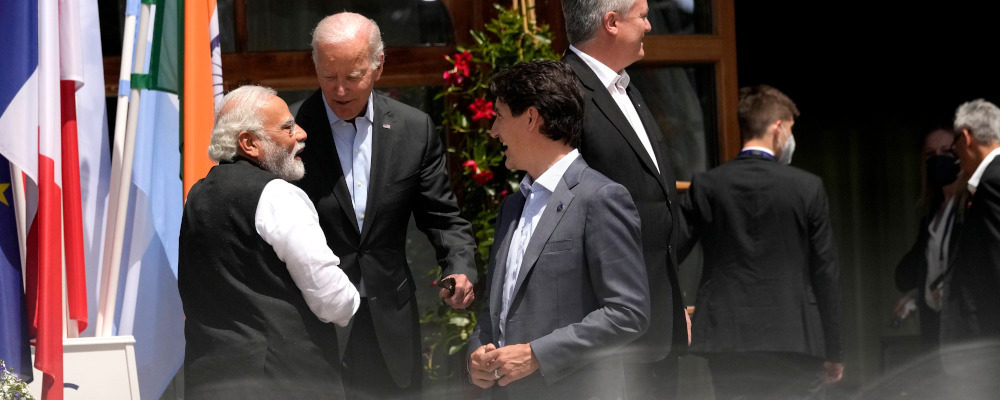 India's Prime Minister Narendra Modi, left, speaks with U.S. President Joe Biden, second left, and Canada's Prime Minister Justin Trudeau after a group photo of G7 leaders and Outreach guests at Castle Elmau in Kruen, near Garmisch-Partenkirchen, Germany, on Monday, June 27, 2022. Markus Schreiber/AP Photo.