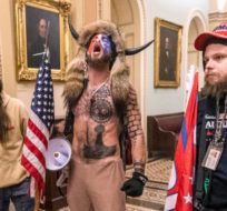 In this Wednesday, Jan. 6, 2021, file photo, supporters of President Donald Trump, including Jacob Chansley, center with fur hat, are seen during the riot at the U.S. Capitol in Washington. A federal judge on Tuesday, July 6, 2021, turned down Chansley's third bid to be released from jail on charges stemming from the riot. Manuel Balce Ceneta/AP Photo.