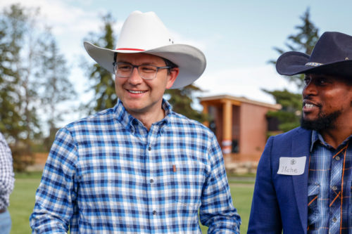 Pierre Poilievre, centre, Conservative Party leadership candidate, attends a party barbecue in Calgary, Alta., Saturday, July 9, 2022. Jeff McIntosh/The Canadian Press.